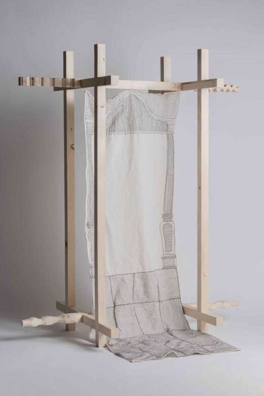 Model. Embroidery (by hand) on cotton fabric. Frame of pine wood, carved in its ends