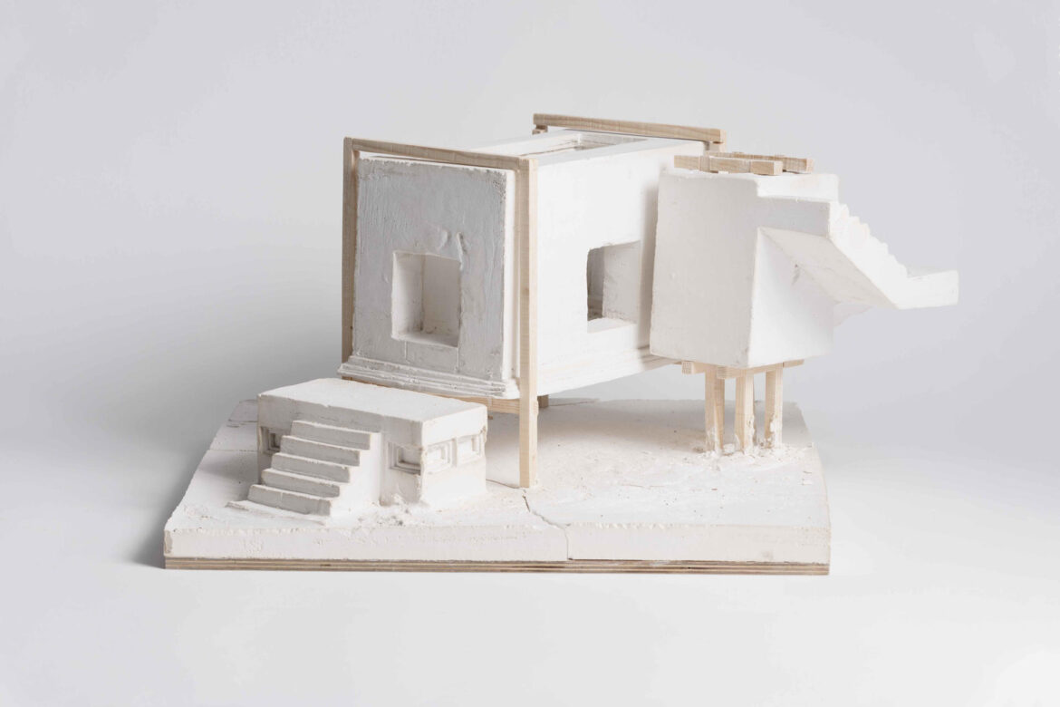 Model. Casted plaster and frame made of pine wood